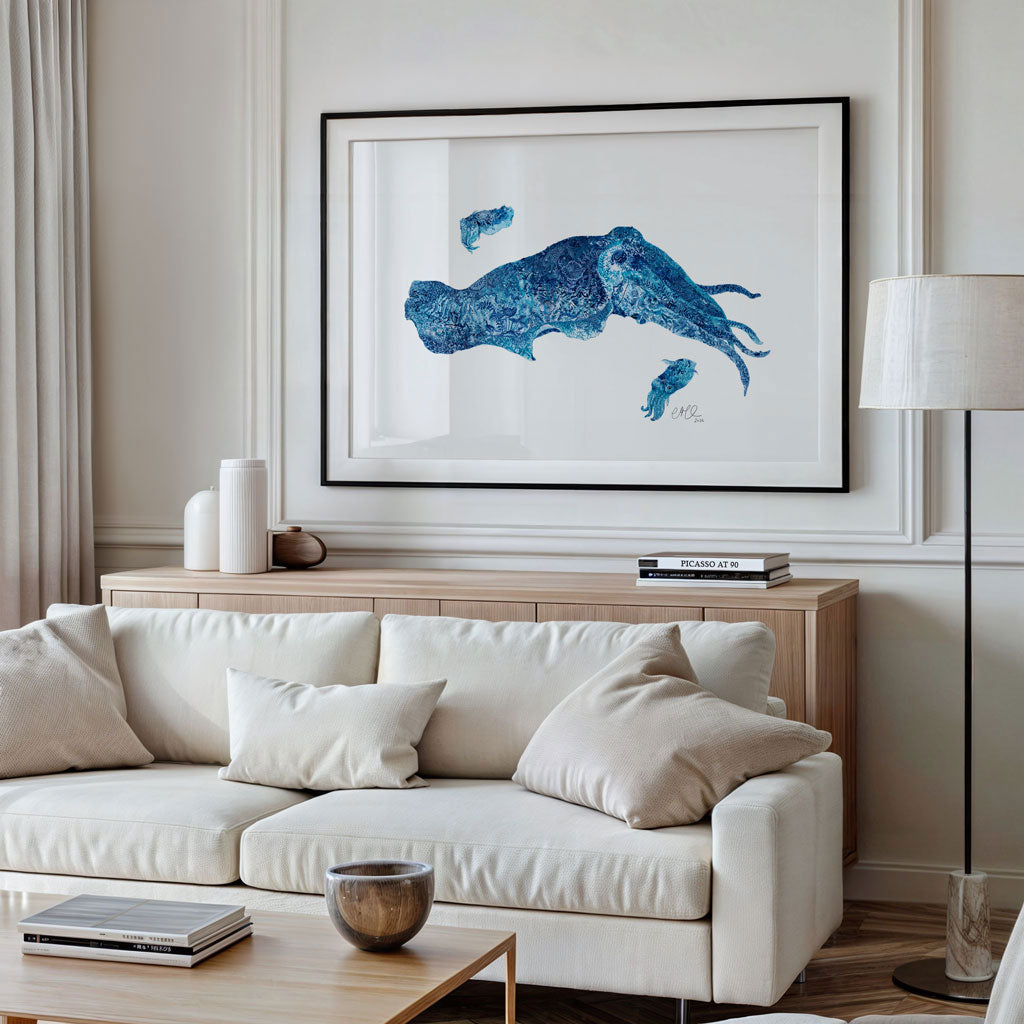 Living room with a white sofa, wooden coffee table, and framed blue cuttlefish art on the wall.