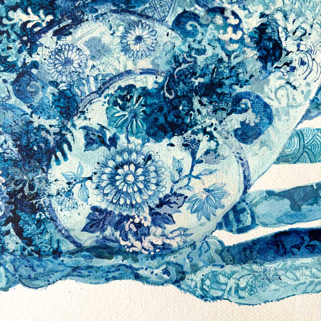 Close-up of a blue and white floral pattern on a textured background