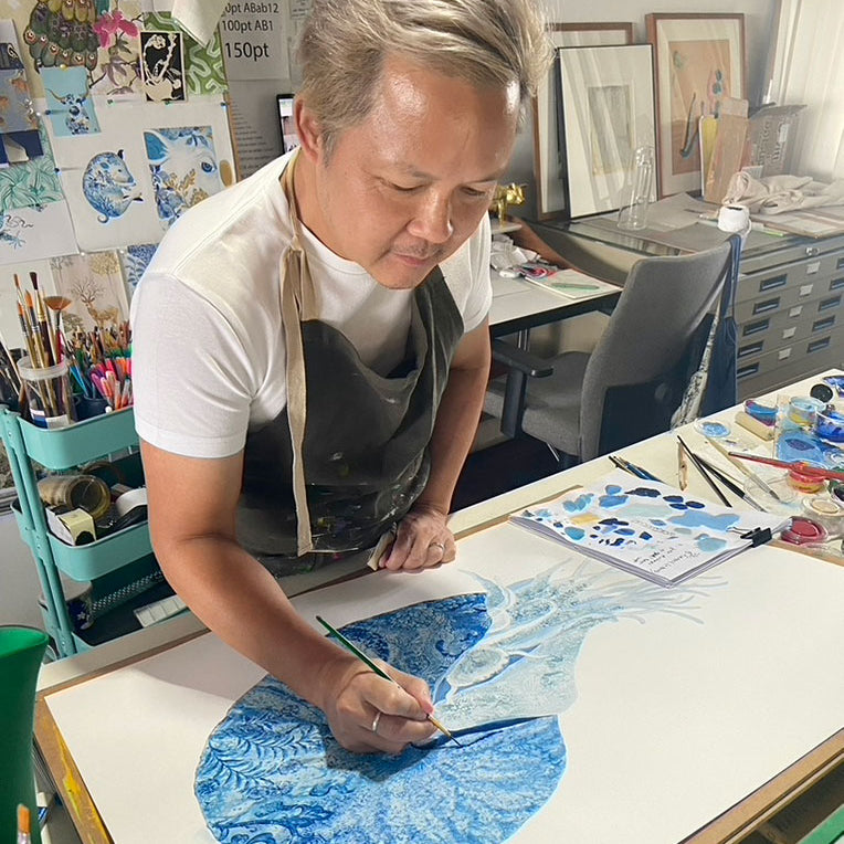 Artist Chris Chun painting a Nautilus
